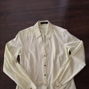 The limited NWOT yellow long sleeves blouse